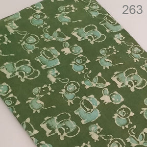 Green and Off White Dabu Hand Block Printed Pure Cotton Fabric with animal print.